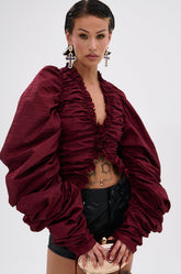 IN IT TO WIN IT RUCHED BLOUSE IN BURGUNDY